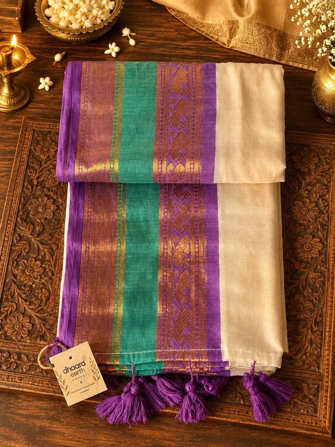 Off white mul cotton saree with purple, green and golden zari border